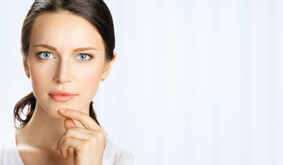 Thinking businesswoman, at office