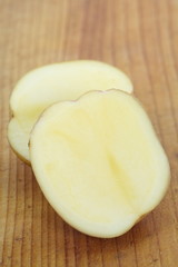Small new potatoes on a wooden