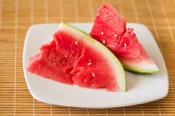 chunky slices of watermelon on a plate