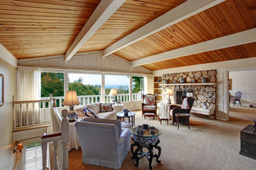 Old fashion living room interior with rocky fireplace