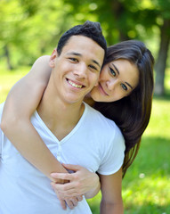 Couple hugging in a park