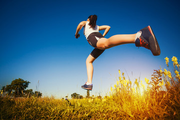 Fototapeta na wymiar Young woman jogging in nature