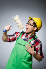 Funny painter with hardhat and roller