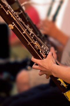 Bassoon in the hands of a musician closeup