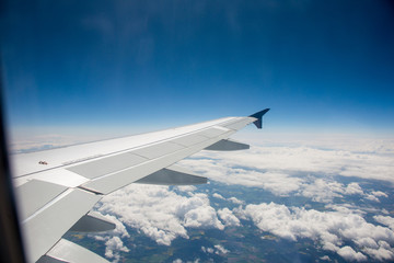 Fototapeta na wymiar Airplane wing out of window