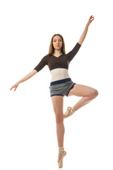Fototapeta na wymiar Beautiful ballet dancer posing in studio