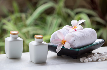 Spa and wellness setting with natural soap, stones and towel