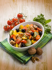 mixed salad with nuts and sliced bread