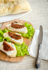 Ciabatta sandwiches with cottage cheese and sun-dried tomatoes