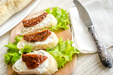 Ciabatta sandwiches with cottage cheese and sun-dried tomatoes