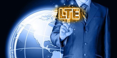 businessman is pushing his finger on lte button
