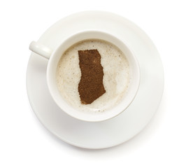 Cup of coffee with foam and powder in the shape of Ghana.(series