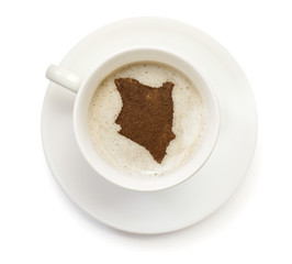 Cup of coffee with foam and powder in the shape of Kenya.(series