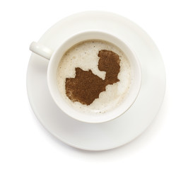 Cup of coffee with foam and powder in the shape of Zambia.(serie