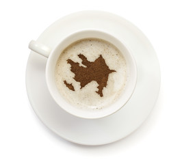 Cup of coffee with foam and powder in the shape of Azerbaijan.(s