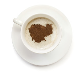 Cup of coffee with foam and powder in the shape of Cambodia.(ser
