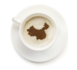 Cup of coffee with foam and powder in the shape of China.(series