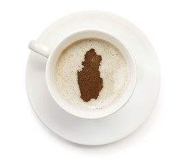 Cup of coffee with foam and powder in the shape of Qatar.(series
