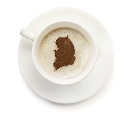 Cup of coffee with foam and powder in the shape of South Korea.(