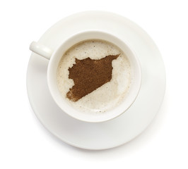 Cup of coffee with foam and powder in the shape of Syria.(series