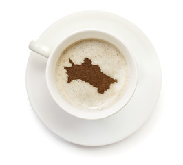 Cup of coffee with foam and powder in the shape of Turkmenistan.