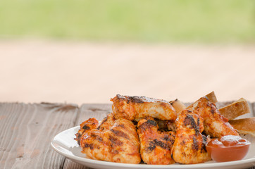 Chicken wings on grill