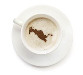 Cup of coffee with foam and powder in the shape of Uzbekistan.(s