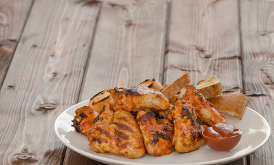 Chicken wings on grill
