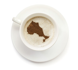 Cup of coffee with foam and powder in the shape of Ontario.(seri