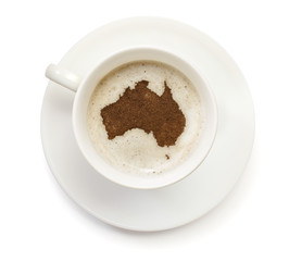 Cup of coffee with foam and powder in the shape of Australia.(se