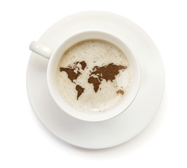 Cup of coffee with foam and powder in the shape of World.(series
