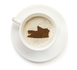Cup of coffee with foam and powder in the shape of Russian Feder
