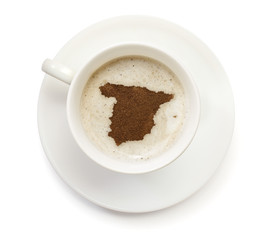 Cup of coffee with foam and powder in the shape of Spain.(series