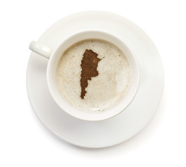 Cup of coffee with foam and powder in the shape of Argentina.(se