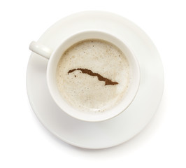 Cup of coffee with foam and powder in the shape of Cuba.(series)