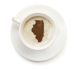 Obraz premium Cup of coffee with foam and powder in the shape of Illinois.(ser