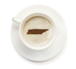 Cup of coffee with foam and powder in the shape of Tennessee.(se