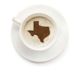 Cup of coffee with foam and powder in the shape of Texas.(series