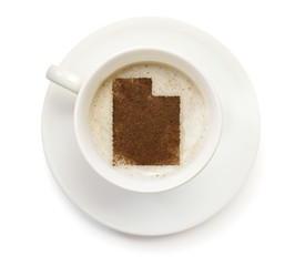 Cup of coffee with foam and powder in the shape of Utah.(series)
