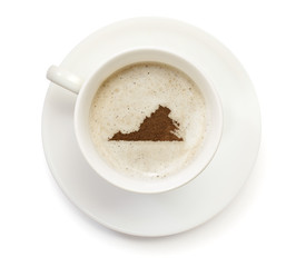Obraz premium Cup of coffee with foam and powder in the shape of Virginia.(ser