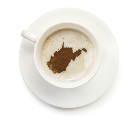 Cup of coffee with foam and powder in the shape of West Virginia