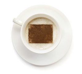 Cup of coffee with foam and powder in the shape of Wyoming.(seri