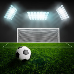 Soccer ball on green stadium arena