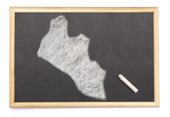 Blackboard with a chalk and the shape of Liberia drawn onto. (se