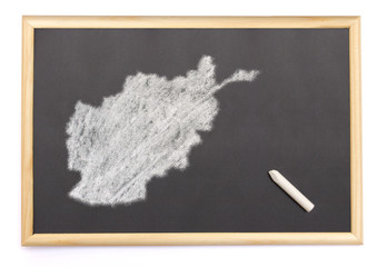 Blackboard with a chalk and the shape of Afghanistan drawn onto.
