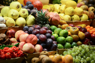 Fruit market with various colorful fresh fruits and vegetables -