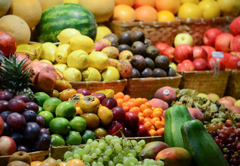 Naklejka na ściany i meble Fruit market with various colorful fresh fruits and vegetables -