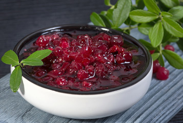 lingonberry jam (cowberries) and branches with leaves