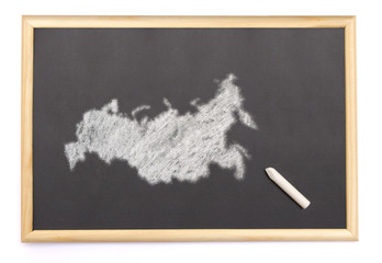 Blackboard with a chalk and the shape of Russia drawn onto. (ser