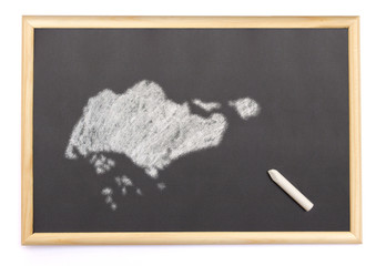 Blackboard with a chalk and the shape of Singapore drawn onto. (